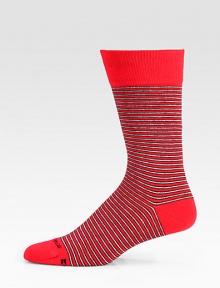 A vibrant stripe pattern is offset by a solid top and heel and shaped in a soft cotton blend.Mid-calf height70% cotton/28% polyester/2% elasticMachine washImported A vibrant stripe pattern is offset by a solid top and heel and shaped in a soft cotton blend.Mid-calf height70% cotton/28% polyester/2% elasticMachine washImported