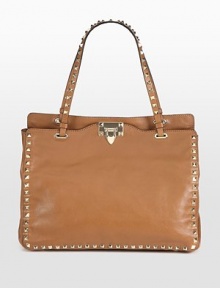 Pyramid studs lend a rock n' roll edge to this sleek leather carryall.Double top handles, 7½ dropDetachable shoulder strap, 18¼ dropFlap-lock closureProtective metal feetOne inside zip pocketTwo inside open pocketsCotton lining13W X 10¼H X 5DMade in Italy Pyramid studs lend a rock n' roll edge to this sleek leather carryall.Double top handles, 7½ dropDetachable shoulder strap, 18¼ dropFlap-lock closureProtective metal feetOne inside zip pocketTwo inside open pocketsCotton lining13W X 10¼H X 5DMade in Italy