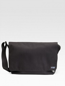 A rugged, everyday look crafted in lasting denier canvas with a convenient laptop compartment. Grip tape closure Exterior zip pocket Interior zip and organizing pockets Laptop compartment Adjustable shoulder strap 18W X 11½H X 5½D Imported A rugged, everyday look crafted in lasting denier canvas with a convenient laptop compartment. Grip tape closure Exterior zip pocket Interior zip and organizing pockets Laptop compartment Adjustable shoulder strap 18W X 11½H X 5½D Imported