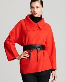 A wide Eileen Fisher leather belt narrows into a skinny tie front for a modern style statement. A wide Eileen Fisher leather belt narrows into a skinny tie front for a modern style statement.