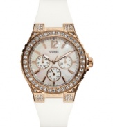 A regal timepiece adorned with crystal shimmer, rosy hues and bold whites, by GUESS.