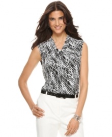 Outfit yourself in this striking tank top from Jones New York, featuring an allover abstract print and chic twist detail at the neckline. It's a brilliant match with white trousers!