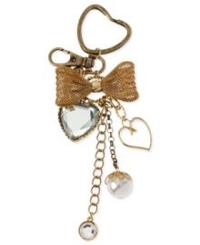 Carry your keys in style with this chain from Betsey Johnson. Crafted from antique gold-tone mixed metal, the key chain is adorned with a glass crystal heart, a ribbon and other glistening accents. Item comes packaged in a signature Betsey Johnson Gift Box. Approximate drop: 2 inches.