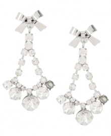 Where's the party? Don't leave home for a festive occasion without Betsey Johnson's chic chandelier earrings! Featuring a sparkling array of clear crystals accented by dainty bows, they're set in silver tone mixed metal. Approximate drop: 2 inches. Where's the party? Don't leave home for a festive occasion without Betsey Johnson's chic chandelier earrings! Featuring a sparkling array of clear crystals accented by dainty bows, they're set in silver tone mixed metal. Approximate drop: 2 inches.