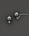 Tahitian black pearls with diamond accents. They are cultured and set in white gold.