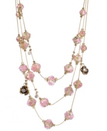 Petal perfection. Pretty pink flowers adorn the layered beads on Betsey Johnson's lovely illusion-style chain necklace. Embellished with flower charms and sparkling crystals, it's crafted in gold tone mixed metal. Approximate length: 18 inches + 3-inch extender.