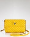 Slim and stylish, this quilted lambskin shoulder bag is a wardrobe essential. Dress up your denim -- and pair it with your LBD for instant cool-girl style.