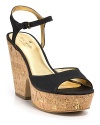 A chunky cork heel feels refreshingly modern on kate spade new york's Penny shoe, rendered in black grosgrain for a decidedly feminine finish.