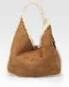 Rich sueded sheepskin pairs with lush shearling in this classically-chic carryall.Shoulder strap, 14 drop Magnetic closure Shearling lining 13½W X 10H X 6D Imported