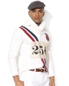 A traditional rugby shirt is cut for a trim, modern fit with athletic details and a bold flag patch, celebrating Team USA's participation in the 2012 Olympic Games.