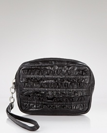 With a ruffle trim and wrist strap, Hobo International's leather coin purse is a cute and compact spot to stow your change. With a ruffle trim and wrist strap, Hobo International's leather coin purse is a cute and compact spot to stow your change.