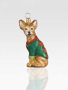 A celebration of Poland's time-honored glassmaking tradition, this charming pup sculpture, dressed in a sparkly argyle sweater, is lovingly crafted by skilled artisans. Mouth-blown Hand-painted Gift boxed 2 high Imported