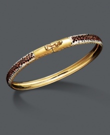 Put a fierce, new spin on your style. This wild bangle features a leopard print enamel surface with diamond-cut edging. Crafted in 14k gold over sterling silver and sterling silver. Approximate diameter: 2-1/2 inches.