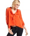 Tres-cute: a peter pan collar adds a playful touch to this lace-adorned, high-low blouse from XOXO!