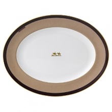 Wedgwood pays tribute to the traditional English equestrian lifestyle with this fine platter inspired by the work of 18th-century horse painter George Stubbs. Burnished gold silhouettes, classic stirrup stripes and rich shades of tan and brown evoke the stylish essence of horse riding. Wedgwood pays tribute to the traditional English equestrian lifestyle with this fine platter inspired by the work of 18th-century horse painter George Stubbs. Burnished gold silhouettes, classic stirrup stripes and rich shades of tan and brown evoke the stylish essence of horse riding.