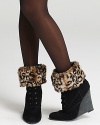 Take your booties higher with these decadent, faux fur-topped socks.