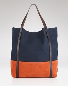 In a modern color-block design, this roomy Burberry tote is ideal for both errands and travel. In a modern color-block design, this roomy Burberry tote is ideal for both errands and travel.