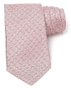 A textural pattern tie in an understated color resolves your workday attire with simple refinement.