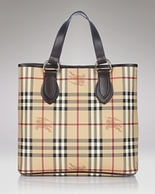 Printed coated canvas tote with leather trim. Double leather handles. Snap bridge closure. Inside zip, cell phone and additional pockets. Lined. Printed coated canvas tote with leather trim. Double leather handles. Snap bridge closure. Inside zip, cell phone and additional pockets. Lined.