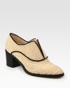 Timeless design updated by a woven raffia upper and stacked heel. Stacked heel, 2½ (65mm)Raffia upperLeather solePadded insoleMade in ItalyOUR FIT MODEL RECOMMENDS ordering true size. 