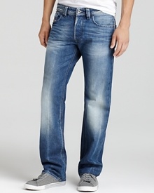 Suave straight leg jeans by Diesel featuring distressing and signature stitching on the back pockets. Suave straight leg jeans by Diesel featuring distressing and signature stitching on the back pockets.