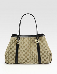 GG fabric with leather trim and interlocking GG ornaments.Double top handles, 7½ drop Snap-strap closure in middle of bag Protective metal feet One inside zip pocket Two inside open pockets Linen lining 14W X 9H X 4;D Made in Italy GG fabric with leather trim and interlocking GG ornaments.Double top handles, 7½ drop Snap-strap closure in middle of bag Protective metal feet One inside zip pocket Two inside open pockets Linen lining 14W X 9H X 4;D Made in Italy