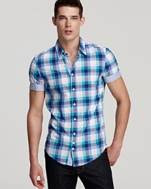 This vibrant check shirt features a touch of designer innovation with a solid contrast interior placket and inner sleeve edge. This vibrant check shirt features a touch of designer innovation with a solid contrast interior placket and inner sleeve edge.