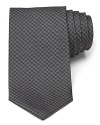 Crafted in pure Italian silk, this design from Armani Collezioni is a standout in your refined collection of ties. Pair with a lighter shade button-down, like pink or pale blue, for a striking combination.