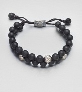 Smooth and polished beaded bracelet of black onyx and sterling silver with logo-engraved clasp.Black onyxSterling silverAdjustable claspAbout 2½ diam.Imported