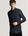 A refined button down shirt rendered in a rich tonal check print, embroidered logo at the chest and a slim fit.