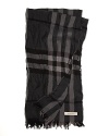 Sophisticated, soft and warm, with a classic masculine plaid updated with a crinkled texture: this cashmere & fine merino wool scarf from Burberry effortlessly pairs with a trench.
