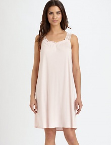 An airy silhouette, discreetly embellished with elegant lace straps, ruffled trim and feminine sheering. Gathered scoopneck with ruffled trimSleevelessSemi-sheer lace straps with scalloped edgesFront ruchingAbout 37 from shoulder to hemBody: 50% cotton/50% modalLace: 85% polyamide/15% elastaneMachine washImported