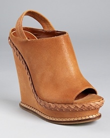 A clog-inspired silhouette from Boutique 9, featuring a feminine braided trim at the mid-sole and rich, lightly-distressed leather. A clog-inspired silhouette from Boutique 9, featuring a feminine braided trim at the mid-sole and rich, lightly-distressed leather.