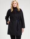 In this coat, you will surely receive compliments, thanks to its buttery leather trim. This impeccable design also features a waist-defining, reversible belt and contrast lining offering brilliant color pops.Feminine necklineSelf-tie beltSlash pocketsLeather trimAbout 36 from shoulder to hemWool/angoraDry clean by leather specialistImported