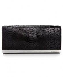 Organization with elegance. Chic python-embossed leather and gleaming signature hardware offer instant appeal to this MICHAEL Michael Kors design that discretely transforms from a shoulder bag to a clutch in a wink. The superbly organized interior is aligned with plenty of compartments for cash, cards, ID and lip gloss. Organization with elegance. Chic python-embossed leather and gleaming signature hardware offer instant appeal to this MICHAEL Michael Kors design that discretely transforms from a shoulder bag to a clutch in a wink. The superbly organized interior is aligned with plenty of compartments for cash, cards, ID and lip gloss.