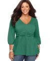 A feminine silhouette highlights NY Collection's three-quarter sleeve plus size top, accentuated by a ruched empire waist-- snag all the colors at an Everyday Value!