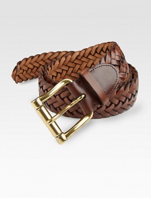 Compliment a well-styled, weekend look with this woven leather belt, finished with a chunky brass roller buckle.LeatherAbout 2 wideImported Compliment a well-styled, weekend look with this woven leather belt, finished with a chunky brass roller buckle.LeatherAbout 2 wideImported