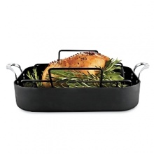 The specially textured Unison Sear Nonstick surface on this Calphalon roaster with nonstick V rack seals in flavor. The triple-riveted stay-cool handles make lifting and turning easy, and oven-to-stovetop versatility is perfect for making gravy. All hard-anodized aluminum roasters are safe for use on stovetops with gas, electric-coil burner and ceramic/glass cook tops The specially textured Unison Sear Nonstick surface on this Calphalon roaster with nonstick V rack seals in flavor. The triple-riveted stay-cool handles make lifting and turning easy, and oven-to-stovetop versatility is perfect for making gravy. All hard-anodized aluminum roasters are safe for use on stovetops with gas, electric-coil burner and ceramic/glass cook tops