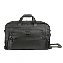 For the business or leisure traveler who appreciates the virtues of traveling light, this is the ideal duffel. It weighs 25%-35% less than comparable cases and offers a roomy interior with a removable garment sleeve, all within a convenient carry-on size. Made from Tumi's exclusive, ultra-tough FXT ballistic nylon, the case features a unique, soft construction design that keeps the bag light. There are organizer pockets inside and out, a telescoping handle and smooth-rolling wheels. For the business or leisure traveler who appreciates the virtues of traveling light, this is the ideal duffel. It weighs 25%-35% less than comparable cases and offers a roomy interior with a removable garment sleeve, all within a convenient carry-on size. Made from Tumi's exclusive, ultra-tough FXT ballistic nylon, the case features a unique, soft construction design that keeps the bag light. There are organizer pockets inside and out, a telescoping handle and smooth-rolling wheels.