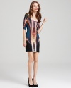 A psychedelic print infuses this Nicole Miller dress with cool while a sultry cutout back reveals a hint of skin.