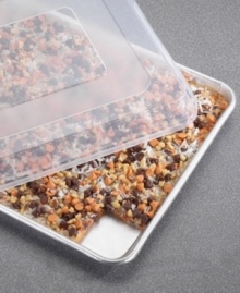 Creating just the right amount of crispy treats, brownies and cookies has never been easier on this half sheet with a natural aluminum core for even baking and great success. Handy lid pops on to keep contents safe and secure on the way to school, brunch or keep them fresh for another day. Lifetime warranty. Creating just the right amount of crispy treats, brownies and cookies has never been easier on this half sheet with a natural aluminum core for even baking and great success. Handy lid pops on to keep contents safe and secure on the way to school, brunch or keep them fresh for another day. Lifetime warranty.