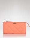 Uptown girls will love kate spade new york's quilted leather wallet. In luxe quilted leather with ample currency space, it's proof practical accessories can exude polish.