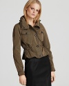 Decidedly feminine, the Burberry Kenbrook jacket offers a chic shield against unfavorable weather. A cinched collar and waistline lend a girlish feel with utilitarian edge.