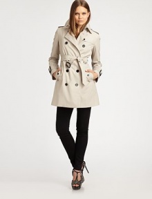 A signature cotton blend design with double breasted front and buckle belting to cinch the waist.Spread collar Double breasted button front Side pockets Shoulder epaulets Belt at waist Wide buckle straps at cuff Front and rear gunflaps Center rear vent About 33 from shoulder to hem Fully lined 65% polyester/35% cotton Dry clean Imported Additional Information Women's Premier Designer & Contemporary Size Guide A signature cotton blend design with double breasted front and buckle belting to cinch the waist.Spread collar Double breasted button front Side pockets Shoulder epaulets Belt at waist Wide buckle straps at cuff Front and rear gunflaps Center rear vent About 33 from shoulder to hem Fully lined 65% polyester/35% cotton Dry clean Imported Additional Information Women's Premier Designer & Contemporary Size Guide