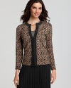 A jeweled neckline glams up this printed cardigan by Jones New York Collection. Pair with a timeless black skirt and pumps for a finished look.