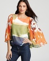 Designed for the retro dancing queen, this flouncy Alice + Olivia top is colorwashed and boasts pleated bell sleeves.