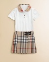 A checked, ruffled collar decorates this piqué polo style.Ruffled Peter Pan collarFront button placketShort sleeves95% cotton/5% elastaneMachine washImportedPlease note: Pattern may vary.