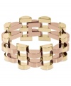 Fashion as an art form. This art deco-inspired bracelet from Michael Kors mesmerizes with an open-link design in golden and rosy hues. Crafted in gold tone and rose-gold tone brass. Approximate length: 7 inches.