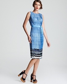 Plunge to dramatic style depths with this Elie Tahari dress. A vibrant cascade of pleats defines an effortless silhouette, while a vivid crush of abstract print finishes the style with modern flair.