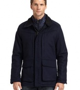 THE LOOKStand collarZip front with snap storm flapDrawcord waistSnap flap pocketsSnap cuffsRemovable down vestTHE FITAbout 27 from shoulder to hemTHE MATERIALOuter shell: 80% wool/20% cashmereOuter fill: polyesterInner shell: polyesterInner fill: 80/20 duck downFully linedCARE & ORIGINDry clean Imported